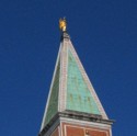 We can see a gold angel on top of the Campanile